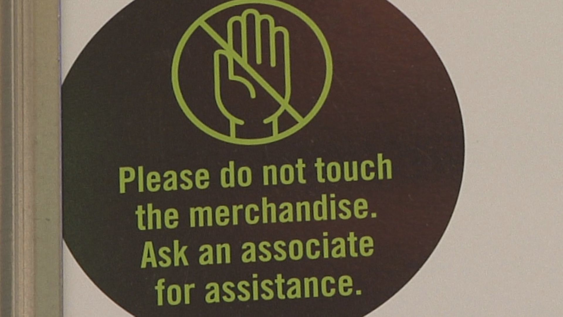 Jourrneys "Please do not touch the merchandise" sign